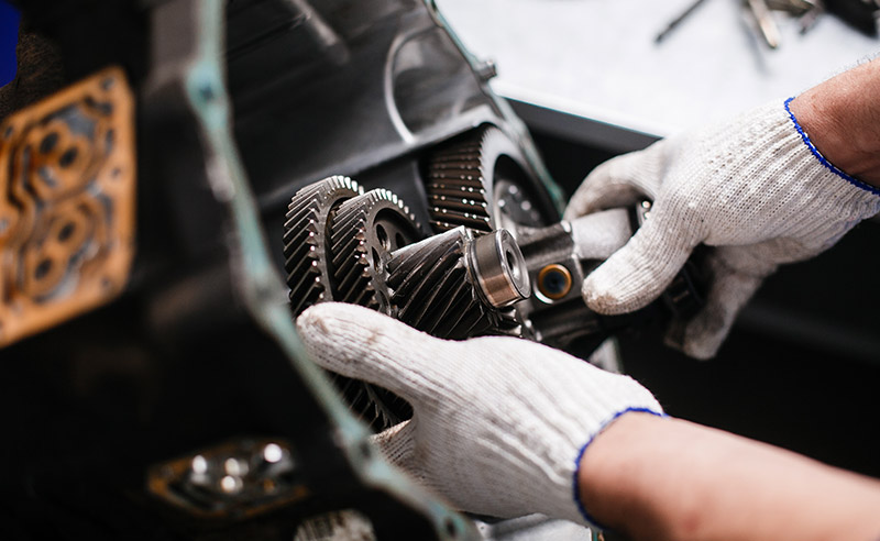 Mechanic Fixing Car Transmission